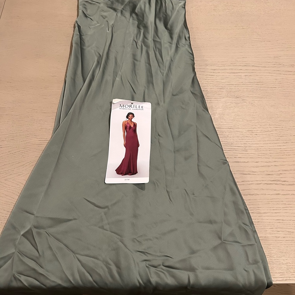 Mori Lee Burgundy Gown with Sage Green Background